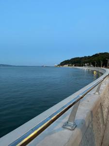 a bridge over a body of water at Oyster Cottage in The Mumbles