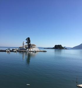 an island in the middle of a large body of water at Charming Retreat in Mesochórion