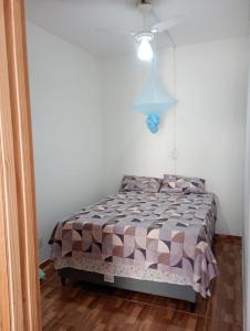 Ένα ή περισσότερα κρεβάτια σε δωμάτιο στο Casa Itacaré