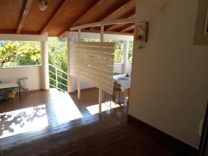 a room with a porch with a table on a balcony at Studio apartman Kata Nin in Nin +26 photos