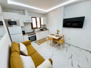 a living room with a couch and a table at Cozy Apartment with Wi-Fi in Costa de Adeje