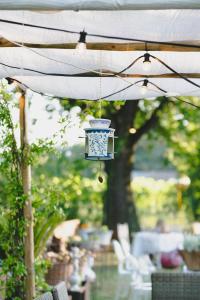 a blue and white lantern hanging from an umbrella at BB Ilde in Villa Verucchio