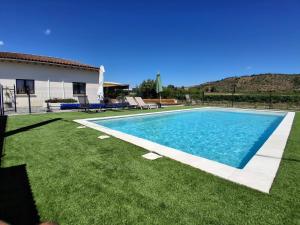 a swimming pool in the yard of a house at La Case in Rosières