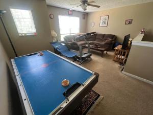 a living room with a large pool table in it at Grand Park Spa Getaway in Westfield
