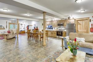 a kitchen and living room with a couch and a table at On-Site Trails Rock River Retreat in Jefferson! in Jefferson
