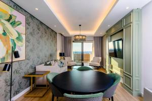 a living room with a table and chairs at Steyn City Hotel by Saxon in Midrand