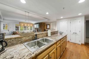 a kitchen with a sink and a counter top at Lodge Tower 487 Three Bedroom Residence in Vail