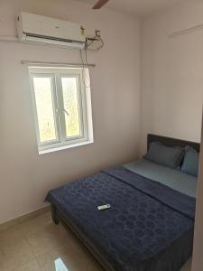 Ένα ή περισσότερα κρεβάτια σε δωμάτιο στο Treva Breeze Villa 2BHK