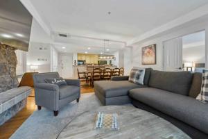 a living room with a couch and chairs and a table at Lodge Tower 487 Two Bedroom Residence in Vail