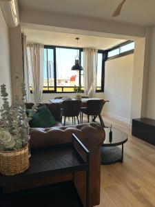a living room with a couch and a table at Mamba Garden III in Calpe