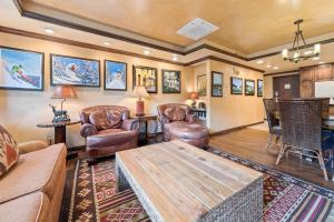 a living room with a couch and chairs and a table at Lodge Tower 494 Two Bedroom Residence in Vail