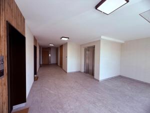 an empty hallway of an office building with a skylight at LOFT APARTAMENT II Kępno in Kępno