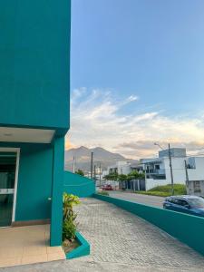 a blue building with a view of a street at Hotel Royal Jaraguá in Jaraguá do Sul