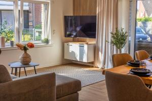 a living room with a couch and a table at vechteliebe in Nordhorn