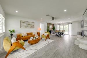 a living room with a couch and a table at 5 Mi to Delray Public Beach Home with Large Patio! in Delray Beach
