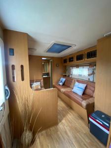 a living room with a couch in an rv at Tornio caravan in Tornio +16 photos