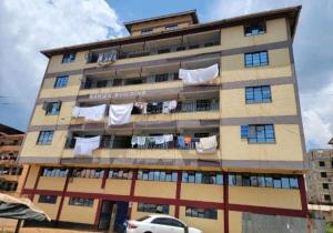 a building with clothes hanging on a balcony at A&T Luxury Homestays in Kisii