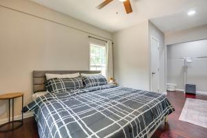 a bedroom with a bed and a ceiling fan at Inviting Home with Backyard 8 Mi to Dtwn Atlanta! in Atlanta