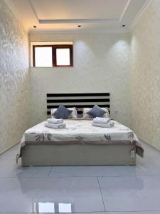 Ένα ή περισσότερα κρεβάτια σε δωμάτιο στο Home Hotel BM