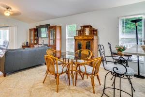 a dining room with a glass table and chairs at 4 Mi to Beaches Fort Myers Escape with Patio in Fort Myers