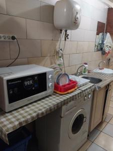Η κουζίνα ή μικρή κουζίνα στο Apart-otel'"Tsarskoe-selo" +18 φωτογραφίες