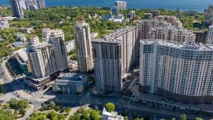 an aerial view of a city with tall buildings at Rodos ArCadia Apartments in Odesa