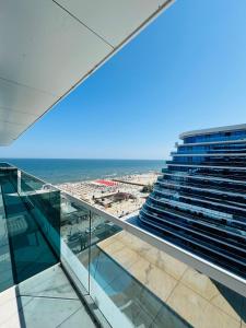 a view of the ocean from the balcony of a building at White Titanic -Luxury Turism in Mamaia Sat/Năvodari