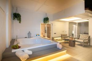 a large bathroom with a large tub in a room at Luxury Penthouse with Jacuzzi & Large Terraces by Passeig de Gràcia in Barcelona +56 photos