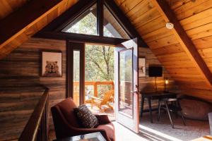 an open living room with a window and a desk at The Refugio #2552 in Big Bear Lake