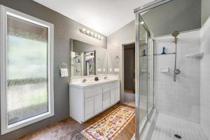 a bathroom with a white sink and a shower at Mt Doble Dream Home #504 in Big Bear City +33 photos
