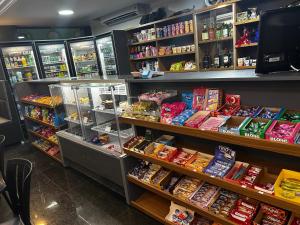 a store filled with lots of different types of food at Gran hotel teatro in Manaus