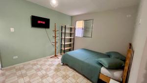 Postel nebo postele na pokoji v ubytování Guest House do Guerreiro