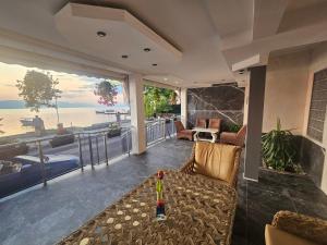 a living room with a view of the ocean at Villa Lena in Ohrid