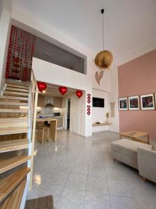 a living room with a couch and a table at Cosy Nest In Samos in Samos