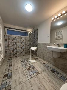 a bathroom with a sink and a mirror at TamTam Urban in Cluj-Napoca +19 photos