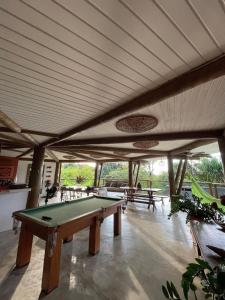 a room with a pool table in a building at T Tree Luxury Villa in Pipa