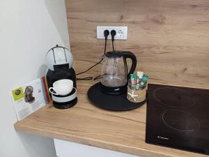 a counter with a blender and a coffee maker on it at Private Villa with Pool - Utjeha Hills in Utjeha