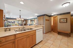 a kitchen with a sink and a counter top at Lodge Tower 594 One Bedroom Residence in Vail