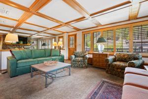 a living room with a couch and chairs and a table at Lodge Tower 599 One Bedroom Residence in Vail