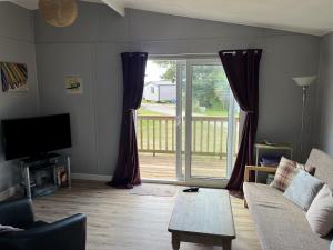 Televiisor ja/või meelelahutuskeskus majutusasutuses Chalet 3 Wipeout