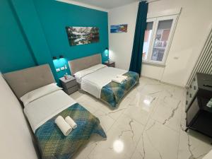 Postel nebo postele na pokoji v ubytování Luna Guest House