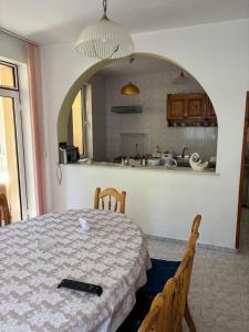 a room with a table with a remote control on it at Panoramic Villa in Predeal in Predeal