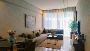 a living room with a couch and a table at unocapital in Casablanca