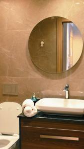 a bathroom with a sink and a mirror at unocapital in Casablanca
