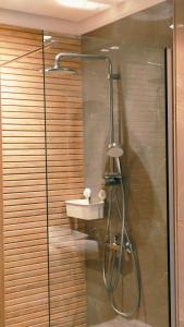 a bathroom with a shower with a sink at unocapital in Casablanca +43 photos