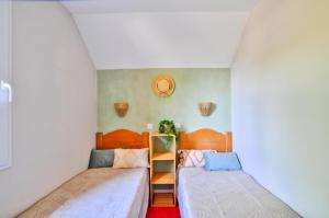 Postel nebo postele na pokoji v ubytování La résidence du Lac - maeva Home - Maison 3 pièces + coin cabine 8 personnes - Prestige MAE-5933 + 18 fotografií