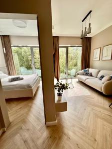 Ένα ή περισσότερα κρεβάτια σε δωμάτιο στο Aparthotel Ukiel Premium nad Zatoką