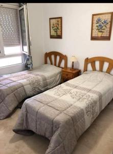 Ένα ή περισσότερα κρεβάτια σε δωμάτιο στο Deux chambres, Orihuela Costa