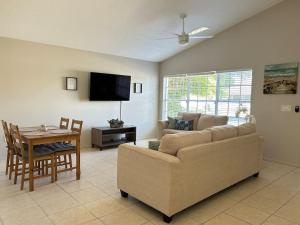 a living room with a couch and a table at Relaxing Getaway in Sarasota Great Location Whole House in Sarasota