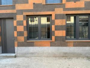 a building with three windows on the side of it at Adelaida in Yerevan
